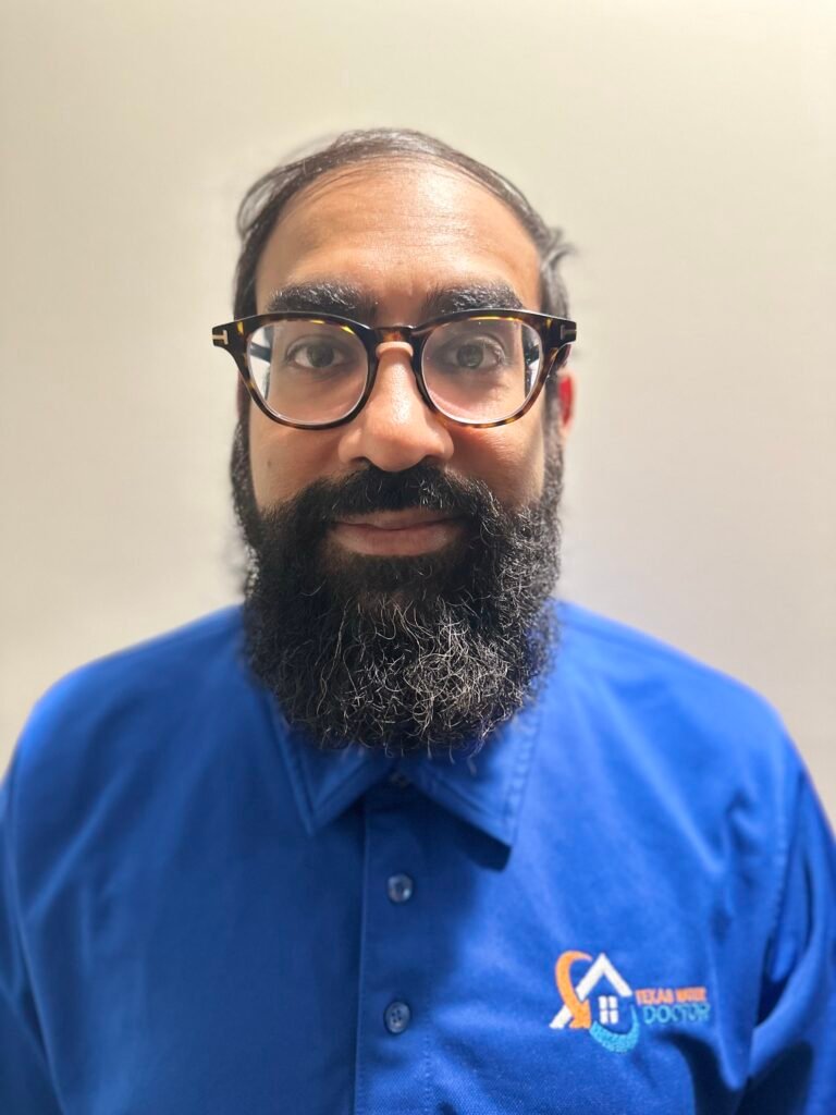 KJ Raja, owner of Texas Water Doctor, on-site at a Dallas water damage job
